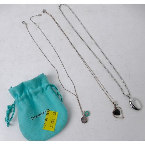 337 - Tiffany & Co necklace in blue pouch weight +/- 4 grams, Jet necklace and white metal locket on chain