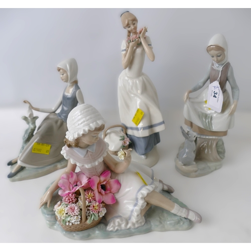 34 - Three Lladro figurines and another similar