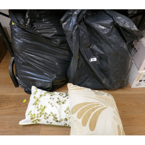 63 - Three bags of sofa cushions