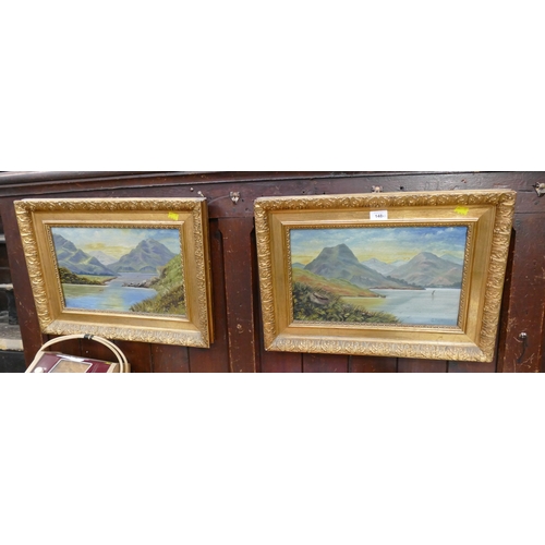 148 - Pair of lakes scene oil paintings, signed Harwood in ornate gold coloured frames