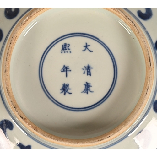 17 - A Chinese blue and white bowl, with repeating foliate and scroll decoration with six character mark ... 