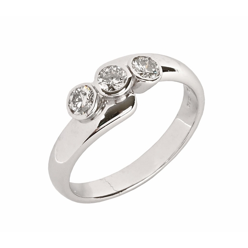 320 - An 18 ct white gold offset three stone ring, set with natural diamonds.  Size N.