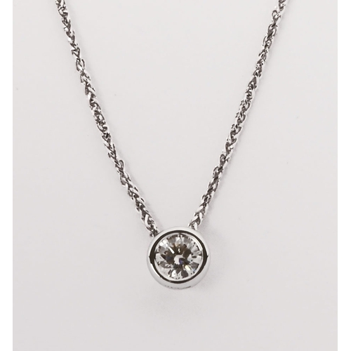 327 - A 18 ct white gold slider pendant on chain, set with a natural diamond.