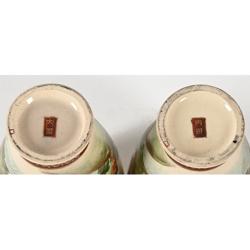 36 - A pair of Japanese vases, decorated with pagodas bridges etc.  Height 12 cm.