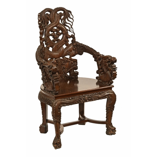 49 - An oriental carved armchair, the arms and back in the form of dragons.  Height 110 cm, width 62 cm, ... 