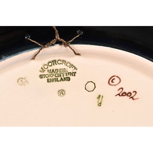 140 - A Moorcroft Quiet Waters patterned dish, decorated with Coy Carp, with wall hanging plaque, marked t... 