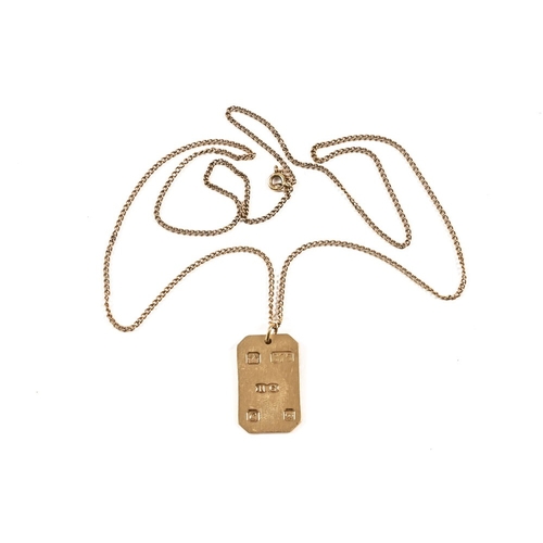 331 - A 9 ct gold pendant, suspended on a yellow metal chain. 8.5 grams.