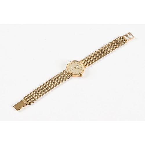 569 - A Geneve 9 ct gold ladies wristwatch, the dial marked Geneve Gold and with baton markers, cased.  Di... 