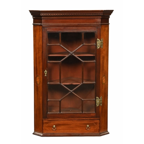 An Edwardian inlaid corner cupboard of small form, with shell ...