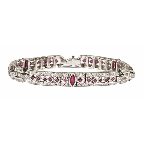 200 - An 18 ct white gold diamond and ruby bracelet. Length 18 cm, the large rubies measuring +/- 6 mm in ... 