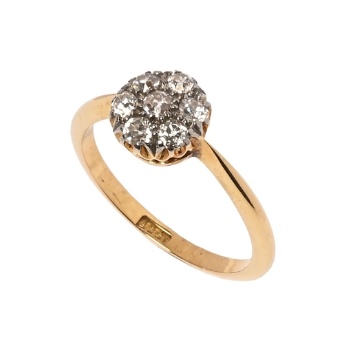 234 - An 18 ct gold diamond daisy cluster ring.