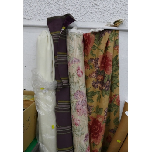 64 - Parasol and two part rolls of fabric