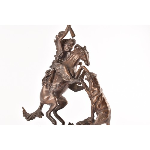 307 - After Charles Marion Russell (American, 1864-1926)A bronze of a cowboy fighting off a mountain lion,... 