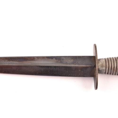 309 - An FS Fairbairn Sykes British Commando dagger, with ribbed metal hilt and crossguard, the double edg... 