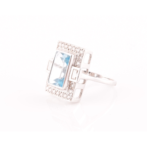 7 - An 18ct white gold, diamond, and aquamarine cocktail ring, set with a mixed rectangular-cut aquamari... 