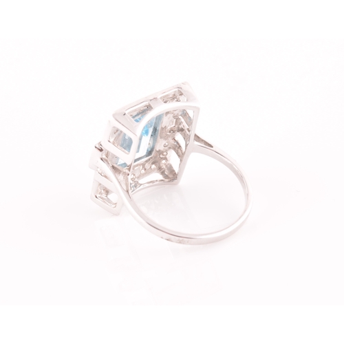 7 - An 18ct white gold, diamond, and aquamarine cocktail ring, set with a mixed rectangular-cut aquamari... 