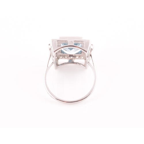 7 - An 18ct white gold, diamond, and aquamarine cocktail ring, set with a mixed rectangular-cut aquamari... 