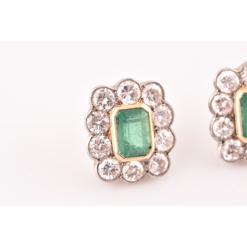 8 - A pair of 18ct yellow gold, diamond, and emerald earrings, each set with a mixed emerald-cut emerald... 