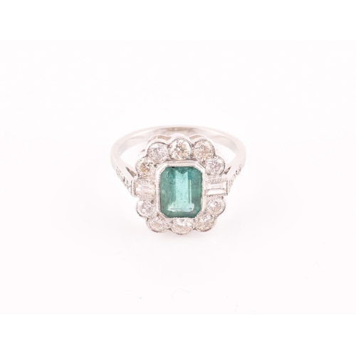 9 - A diamond and emerald cluster cocktail ring, set with an emerald-cut emerald of approximately 1.60 c... 