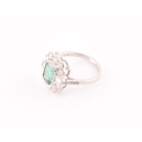 9 - A diamond and emerald cluster cocktail ring, set with an emerald-cut emerald of approximately 1.60 c... 