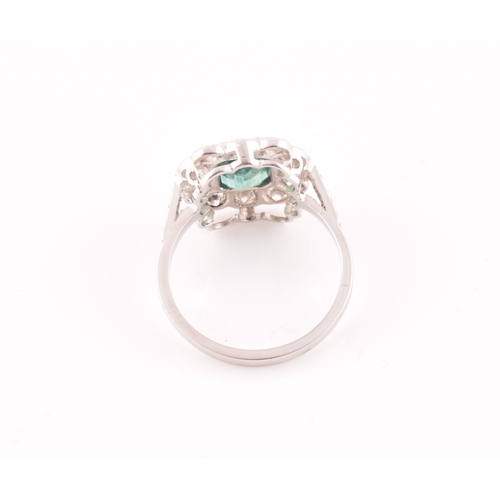 9 - A diamond and emerald cluster cocktail ring, set with an emerald-cut emerald of approximately 1.60 c... 