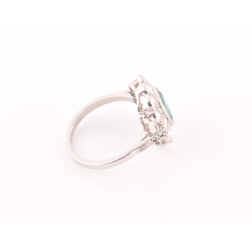 9 - A diamond and emerald cluster cocktail ring, set with an emerald-cut emerald of approximately 1.60 c... 