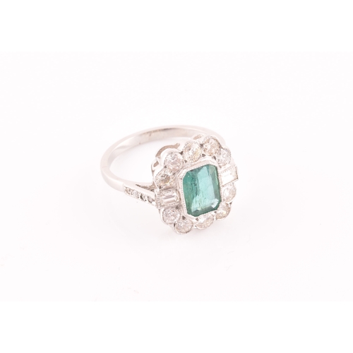 9 - A diamond and emerald cluster cocktail ring, set with an emerald-cut emerald of approximately 1.60 c... 