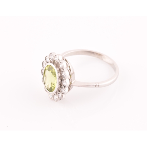 10 - A platinum, diamond, and peridot cluster ring, the mixed oval-cut peridot of approximately 1.60, wit... 