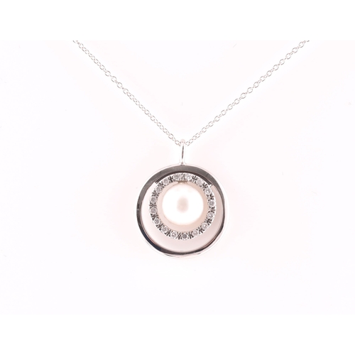 11 - A diamond and pearl halo pendant, centred with a cultured white pearl, measuring approximately 8.1 m... 