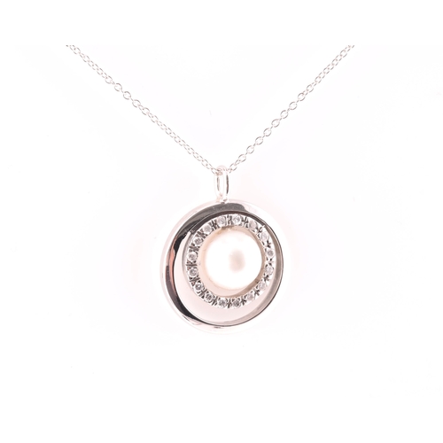 11 - A diamond and pearl halo pendant, centred with a cultured white pearl, measuring approximately 8.1 m... 