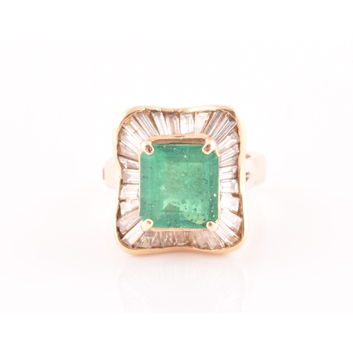 13 - An 18ct yellow gold, diamond, and emerald 'ballerina' cocktail ring, the waved mount inset with tape... 