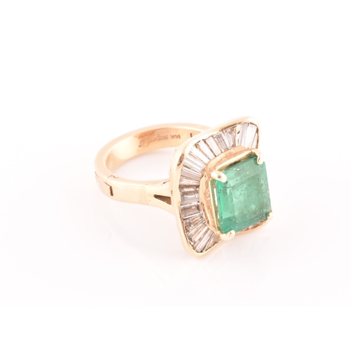 13 - An 18ct yellow gold, diamond, and emerald 'ballerina' cocktail ring, the waved mount inset with tape... 