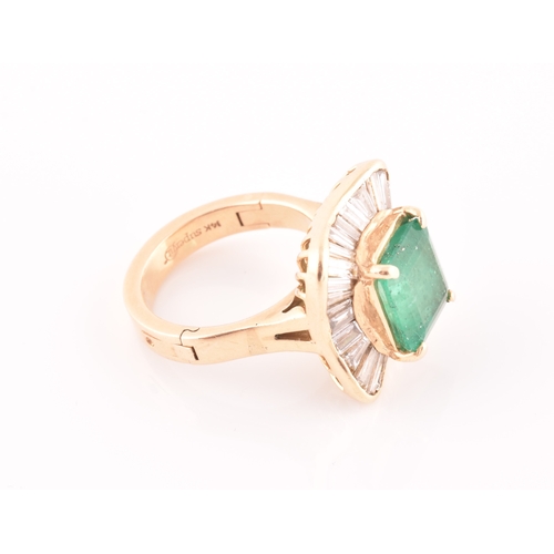 13 - An 18ct yellow gold, diamond, and emerald 'ballerina' cocktail ring, the waved mount inset with tape... 