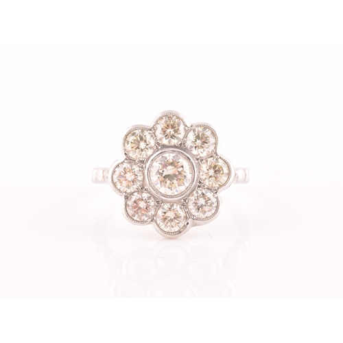 15 - A platinum and diamond floral cluster ring, set with nine round brilliant-cut diamonds, of approxima... 