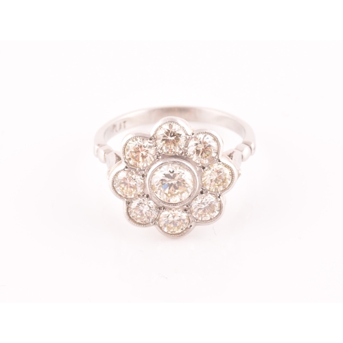 15 - A platinum and diamond floral cluster ring, set with nine round brilliant-cut diamonds, of approxima... 