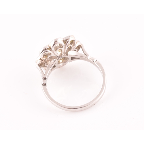 15 - A platinum and diamond floral cluster ring, set with nine round brilliant-cut diamonds, of approxima... 