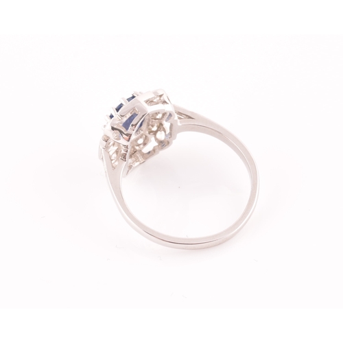 17 - A platinum, diamond, and sapphire ring, centred with a mixed oval-cut sapphire of approximately 1.65... 