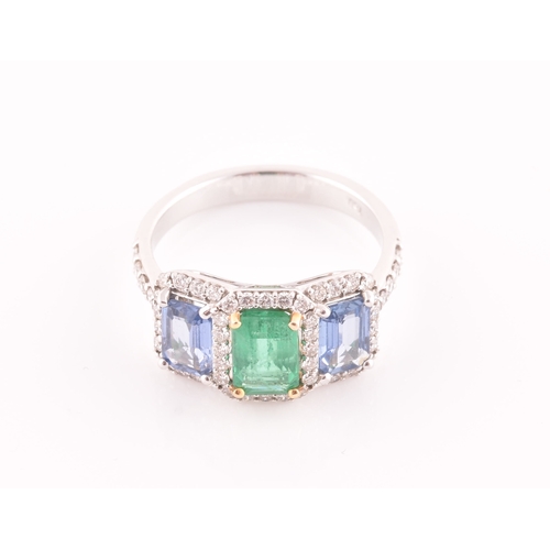 21 - An 18ct white gold, diamond, emerald, and sapphire ring, the triple cluster set with a mixed rectang... 