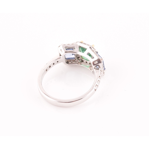 21 - An 18ct white gold, diamond, emerald, and sapphire ring, the triple cluster set with a mixed rectang... 