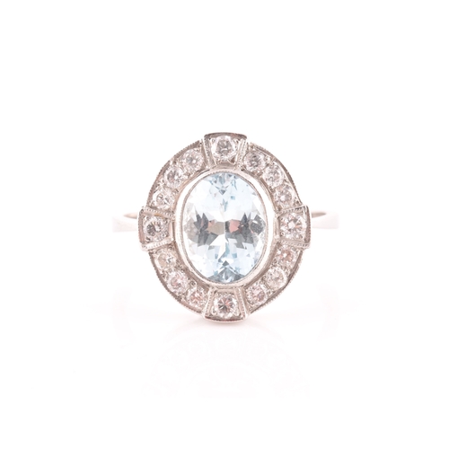 24 - A platinum, diamond, and aquamarine cluster ring, set with a mixed oval-cut aquamarine of approximat... 