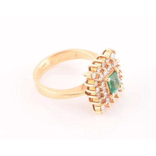 25 - An 18ct yellow gold, diamond, and emerald ring, set with a mixed emerald-cut emerald, within a doubl... 