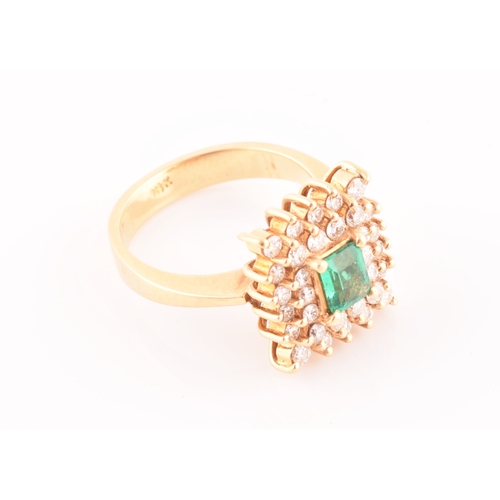 25 - An 18ct yellow gold, diamond, and emerald ring, set with a mixed emerald-cut emerald, within a doubl... 