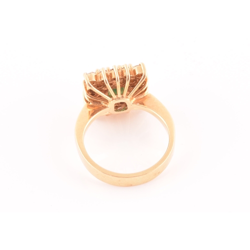 25 - An 18ct yellow gold, diamond, and emerald ring, set with a mixed emerald-cut emerald, within a doubl... 