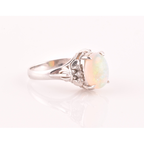 26 - A platinum, diamond, and opal ring, four-claw set with an oval cabochon opal, with three round-cut d... 