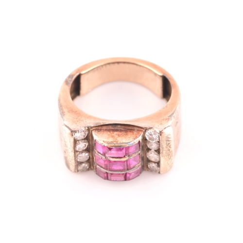 30 - A 1940s ruby and diamond cocktail ring, the raised mount inset with nine mixed square-cut rubies, wi... 