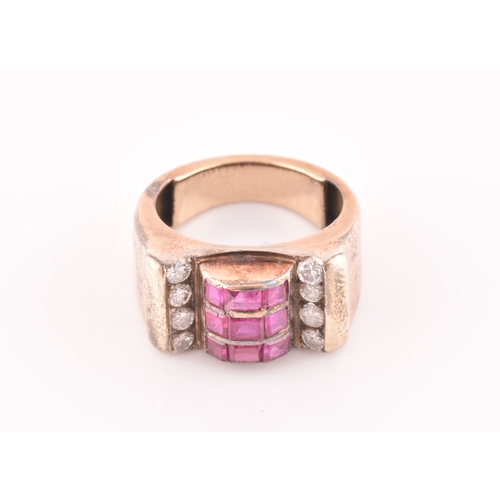 30 - A 1940s ruby and diamond cocktail ring, the raised mount inset with nine mixed square-cut rubies, wi... 