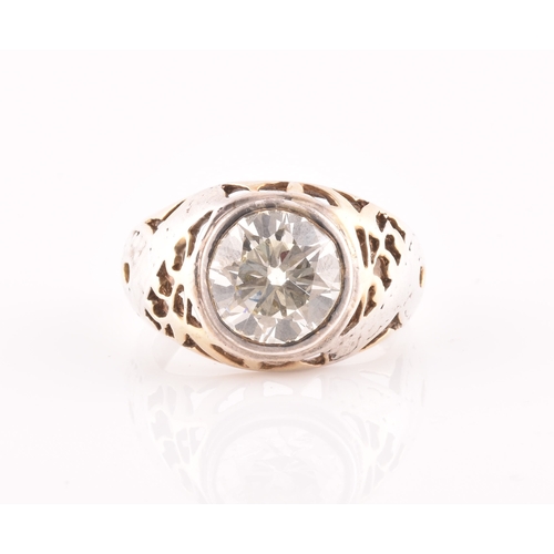 33 - An impressive mid 20th century solitaire diamond ring, set with a round transitional cut diamond, of... 