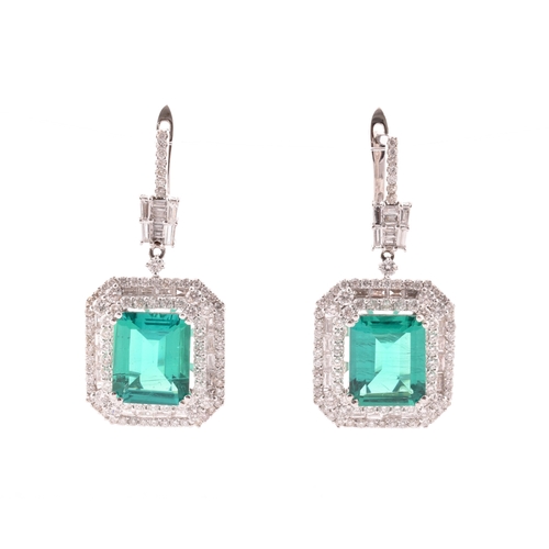 34 - A pair of 18ct white gold, diamond, and emerald pendant drop earrings, each set with a mixed emerald... 