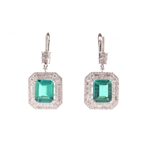 34 - A pair of 18ct white gold, diamond, and emerald pendant drop earrings, each set with a mixed emerald... 