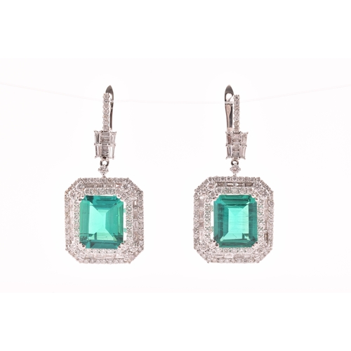 34 - A pair of 18ct white gold, diamond, and emerald pendant drop earrings, each set with a mixed emerald... 